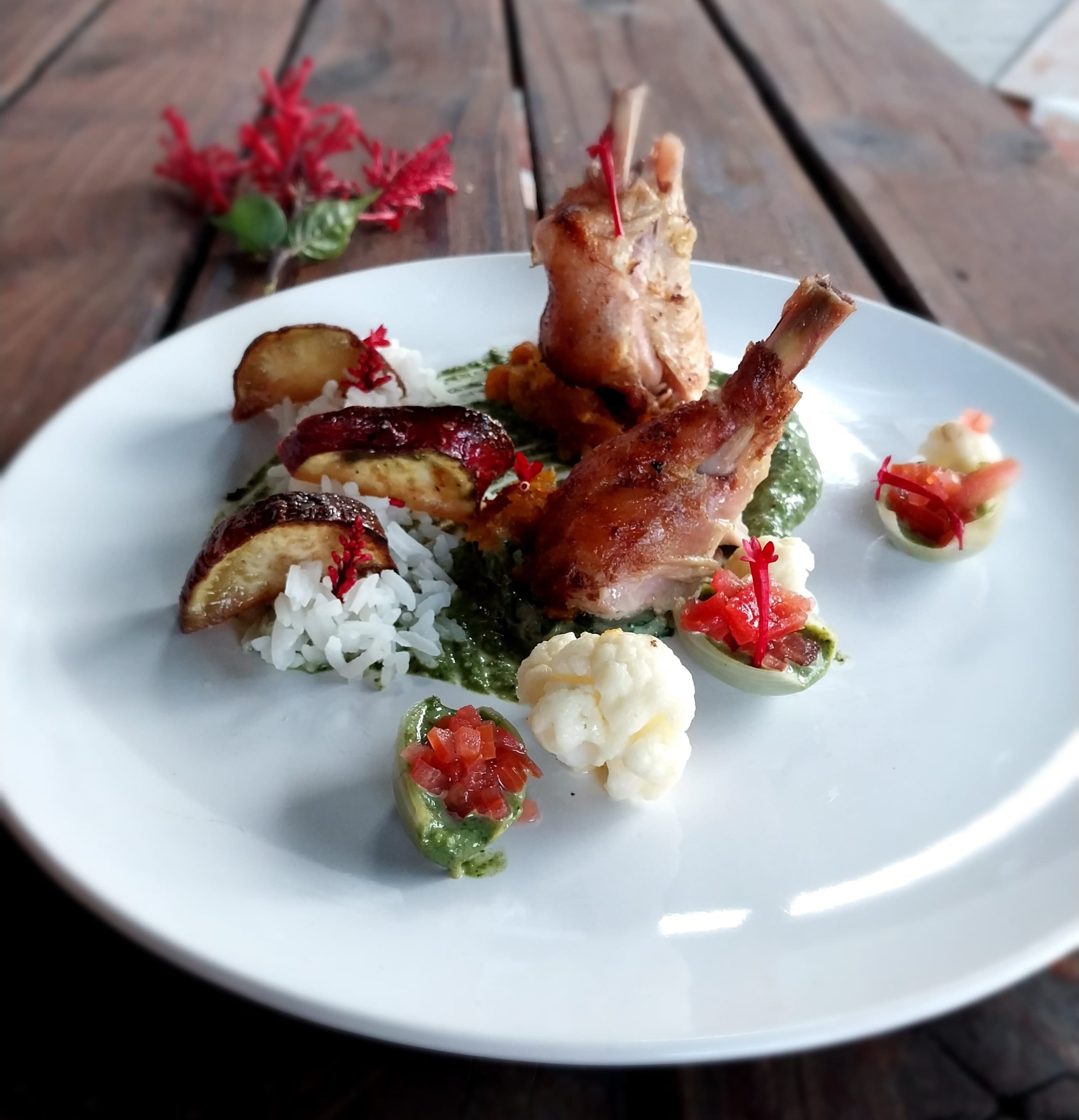 Elegant plated main course featuring gourmet meat, seasonal vegetables, and rich sauce by Chef Nathan Catering